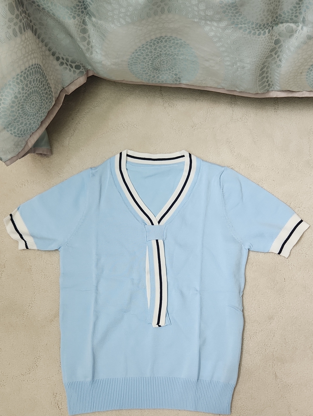 Light Blue Knit Top with Striped V-Neck Tie